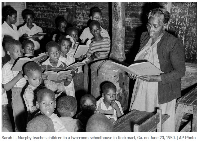 Sarah L. Murphy teches children in a two room schoolhouse in Rockmart, Ga. on June 23, 1950 AP Photo